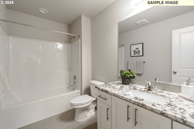 full bathroom with visible vents, toilet, bathtub / shower combination, and vanity