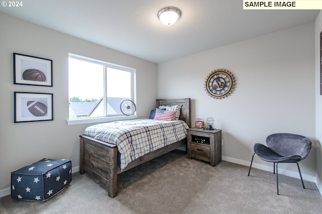 bedroom with carpet flooring and baseboards