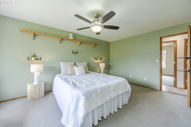 bedroom with baseboards, ceiling fan, and carpet