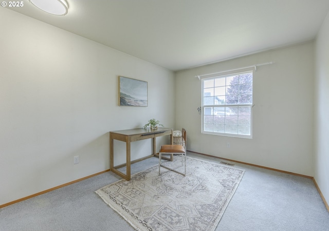 home office with carpet floors, baseboards, and visible vents
