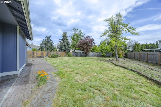 view of yard with a fenced backyard