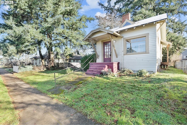 view of front of home with a front lawn