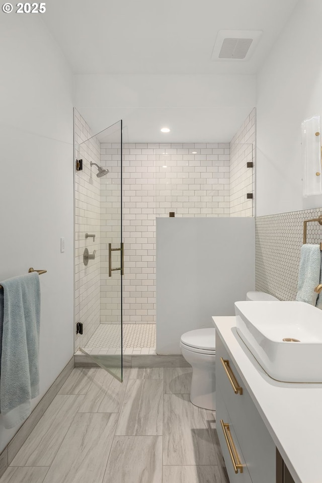1235 Andrews Rd, Lake Oswego, OR 97034 - full bathroom with a stall shower, vanity, tile walls, marble finish floors, and recessed lighting