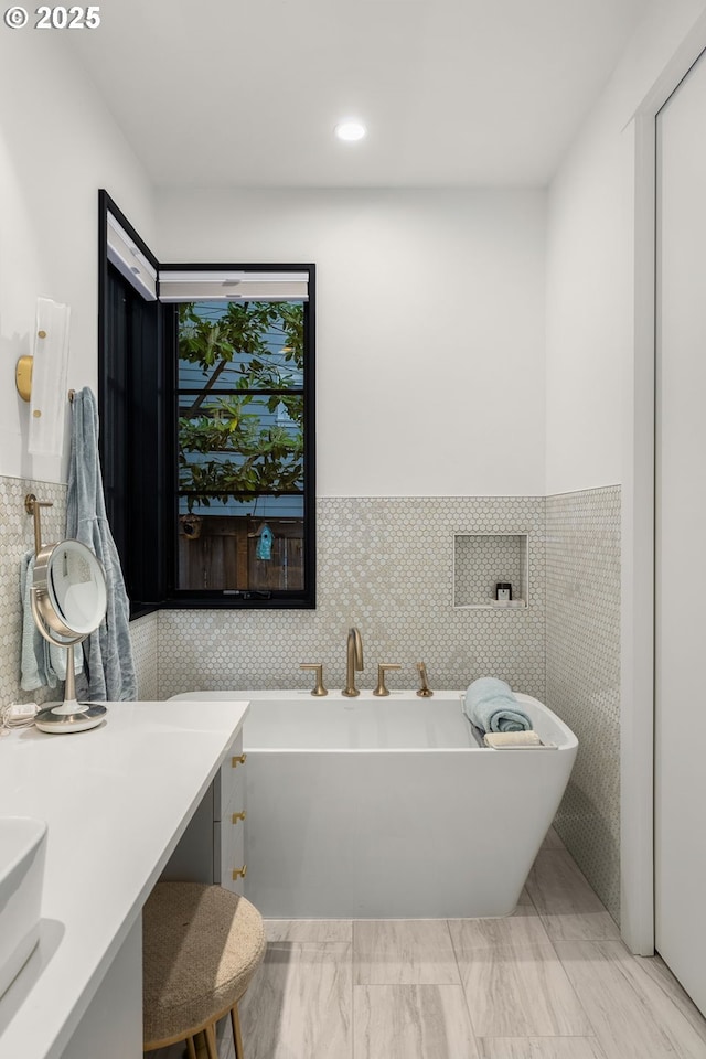 1235 Andrews Rd, Lake Oswego, OR 97034 - bathroom with a freestanding tub, recessed lighting, vanity, tile walls, and marble finish floors