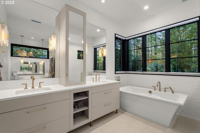 1235 Andrews Rd, Lake Oswego, OR 97034 - full bathroom with a freestanding tub, double vanity, tile patterned floors, and recessed lighting