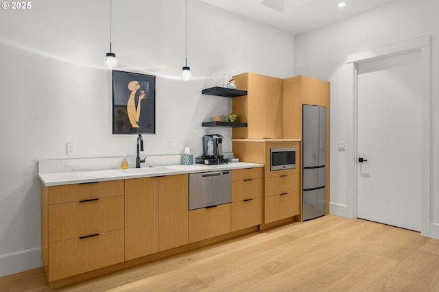 1235 Andrews Rd, Lake Oswego, OR 97034 - kitchen featuring appliances with stainless steel finishes, light wood-style floors, open shelves, hanging light fixtures, and modern cabinets