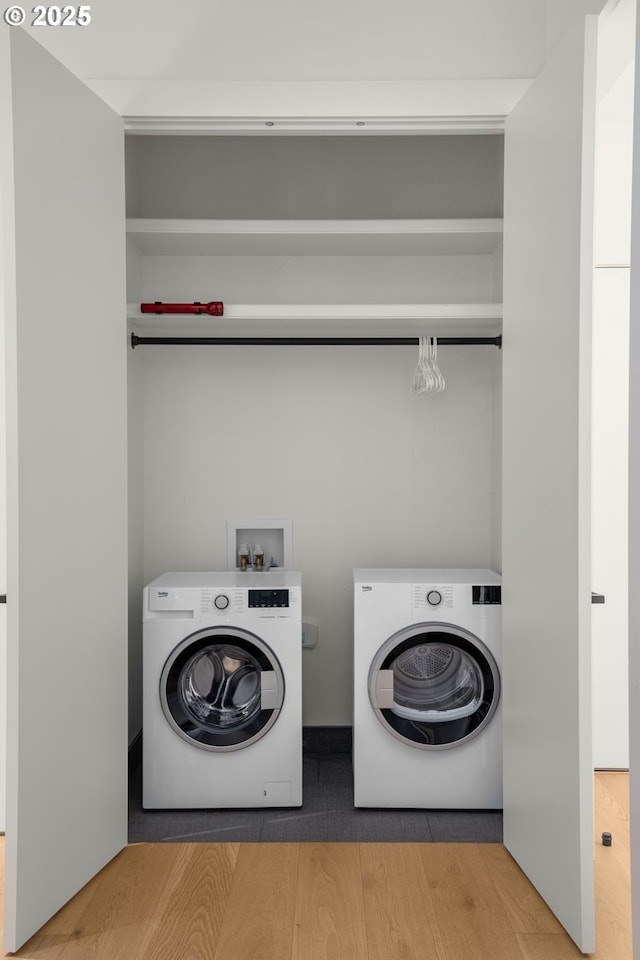 1235 Andrews Rd, Lake Oswego, OR 97034 - laundry area featuring washer and dryer and wood finished floors