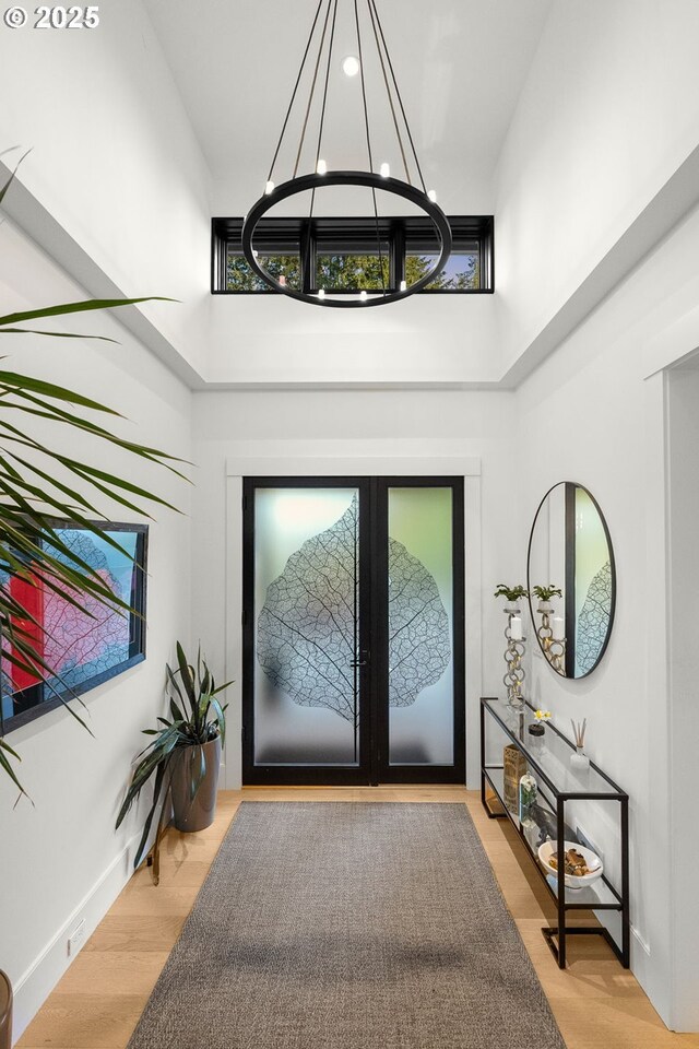 1235 Andrews Rd, Lake Oswego, OR 97034 - foyer entrance with a towering ceiling, a chandelier, french doors, and wood finished floors