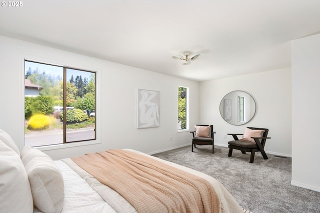 bedroom featuring baseboards, carpet, and visible vents