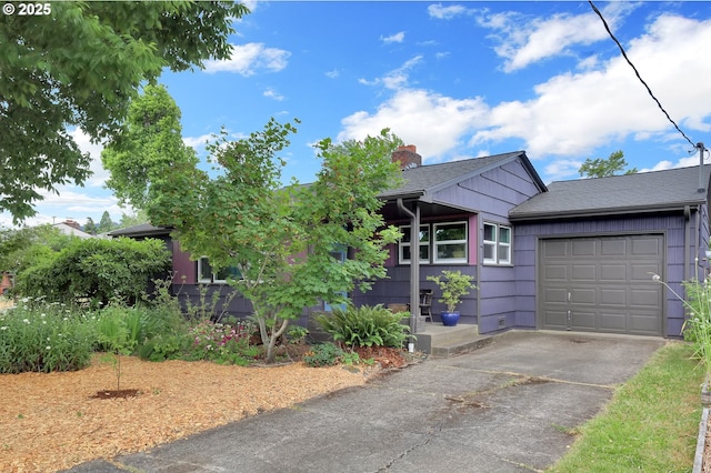 2940 Pearl St, Eugene, OR 97405 - view of front of home featuring driveway, a garage, a chimney, and a shingled roof