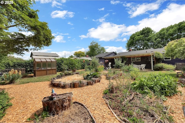 2940 Pearl St, Eugene, OR 97405 - view of yard with a greenhouse and an outdoor structure