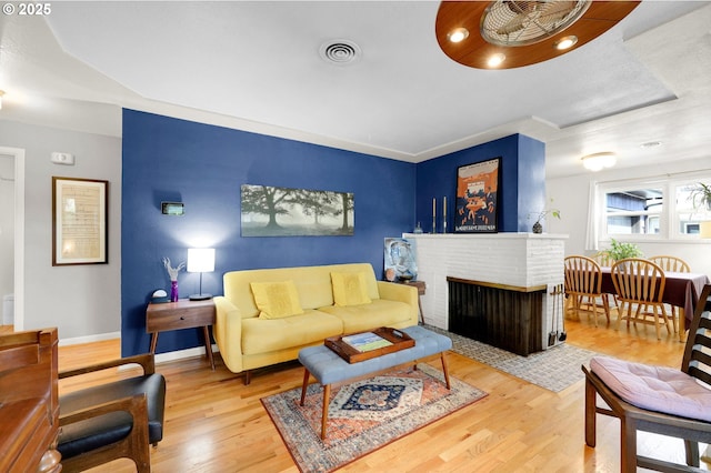 2940 Pearl St, Eugene, OR 97405 - living room featuring wood finished floors and a fireplace