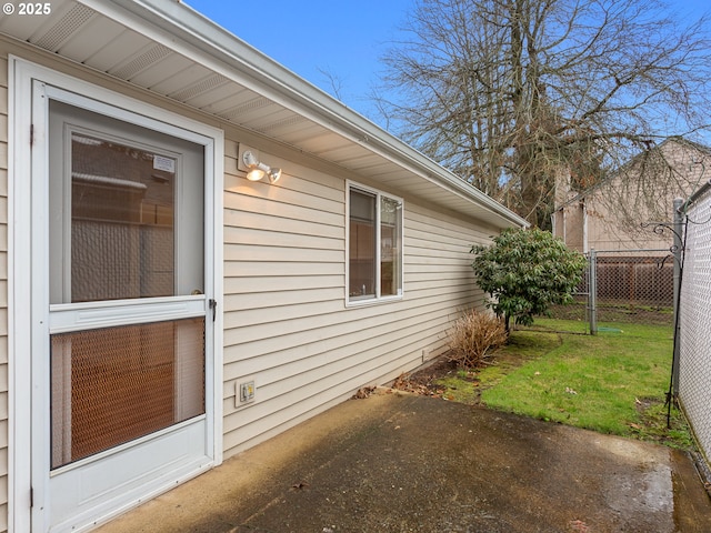 view of side of home with fence