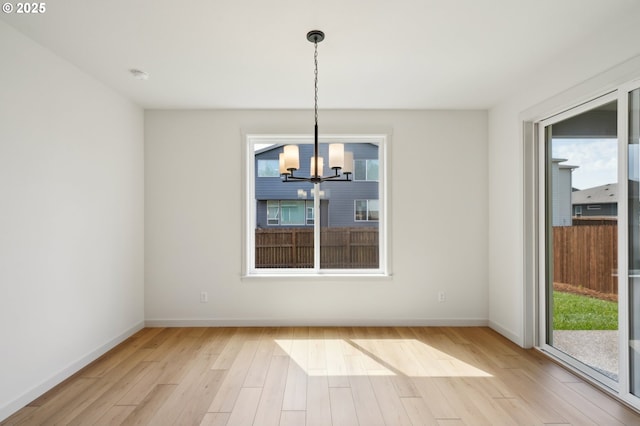 17109 NE 82nd St, Vancouver, WA 98682 - unfurnished dining area featuring baseboards, a chandelier, and wood finished floors