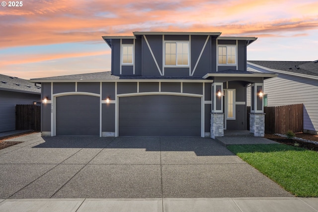 17109 NE 82nd St, Vancouver, WA 98682 - view of front of house featuring fence, stone siding, roof with shingles, concrete driveway, and an attached garage