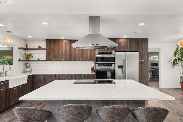 kitchen featuring open shelves, a sink, appliances with stainless steel finishes, modern cabinets, and island range hood