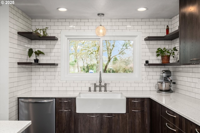 kitchen with open shelves, stainless steel dishwasher, dark brown cabinetry, and a sink