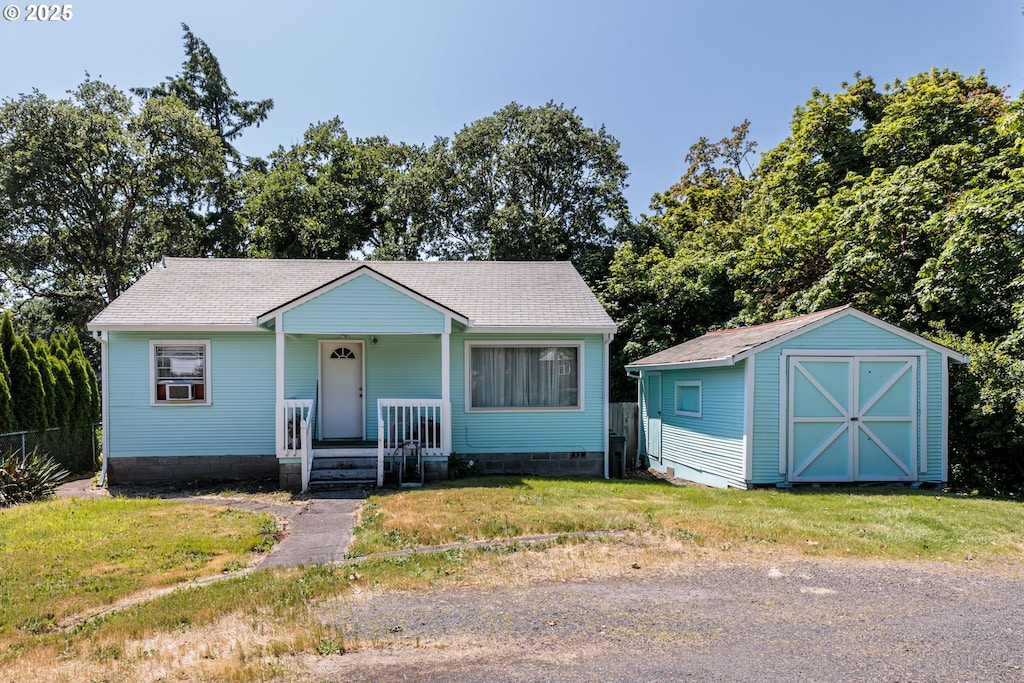 215 S 8th St, Saint Helens, OR 97051 - bungalow-style house with crawl space, a front lawn, roof with shingles, and a porch