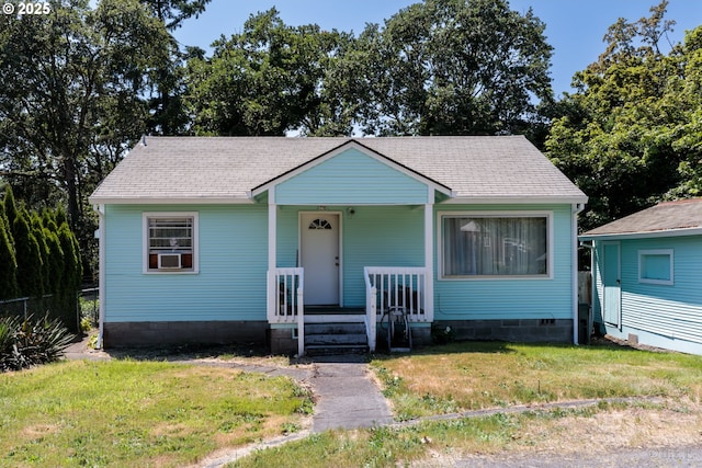 215 S 8th St, Saint Helens, OR 97051 - bungalow-style house featuring covered porch, a front yard, crawl space, and roof with shingles