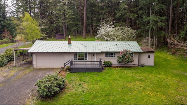 29652 Lusk Rd, Eugene, OR 97405 - view of front of house with a front yard, driveway, an attached garage, a chimney, and metal roof