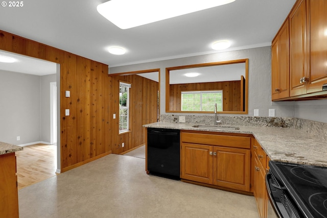 29652 Lusk Rd, Eugene, OR 97405 - kitchen with dishwasher, a sink, brown cabinetry, wood walls, and light stone countertops