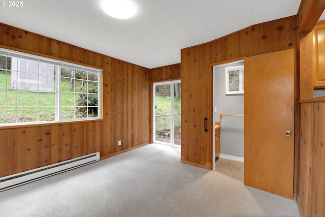 29652 Lusk Rd, Eugene, OR 97405 - spare room with carpet floors, baseboard heating, wooden walls, and baseboards