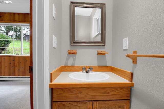 29652 Lusk Rd, Eugene, OR 97405 - bathroom featuring a baseboard radiator, vanity, and a textured wall