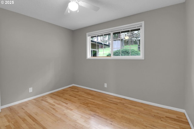 29652 Lusk Rd, Eugene, OR 97405 - spare room with baseboards, wood finished floors, and a ceiling fan