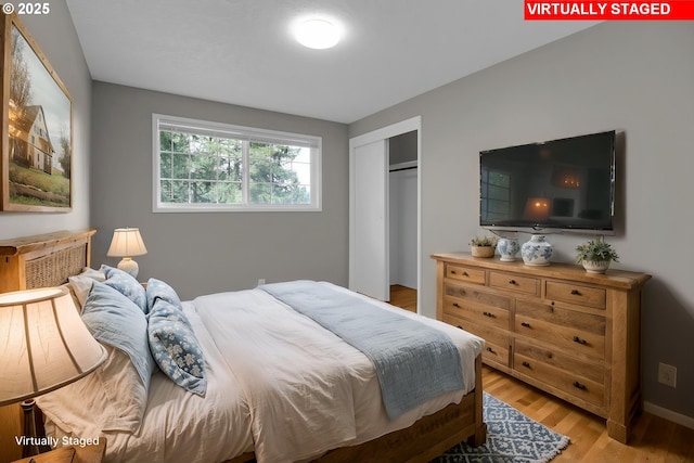 29652 Lusk Rd, Eugene, OR 97405 - bedroom featuring light wood-style flooring, a closet, and baseboards