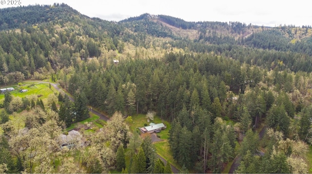 29652 Lusk Rd, Eugene, OR 97405 - aerial view of property and surrounding area with a heavily wooded area and a mountainous background