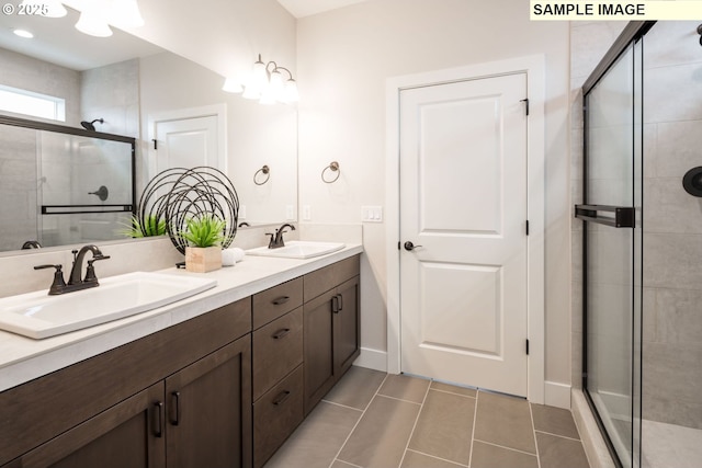 4654 NW 71st Ave, Camas, WA 98607 - bathroom with double vanity, a stall shower, and tile patterned floors