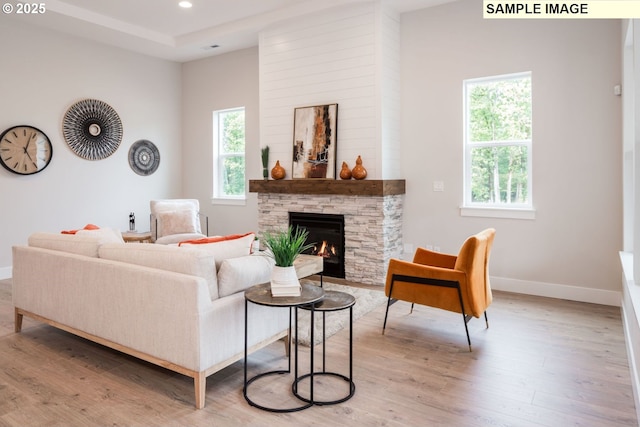 4654 NW 71st Ave, Camas, WA 98607 - living room with a stone fireplace, light wood-style flooring, baseboards, and recessed lighting