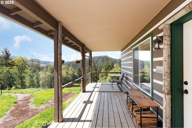 wooden terrace with a mountain view