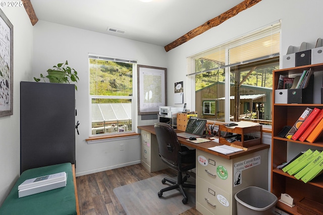 home office with baseboards, wood finished floors, and visible vents