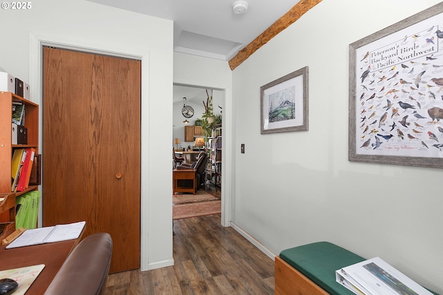 home office featuring dark wood-style flooring and baseboards
