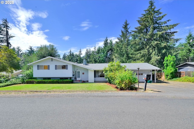 85304 Nestle Way, Pleasant Hill, OR 97455 - split level home featuring driveway, a chimney, and a carport