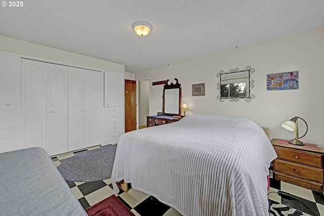 85304 Nestle Way, Pleasant Hill, OR 97455 - bedroom with a closet, a textured ceiling, and tile patterned floors