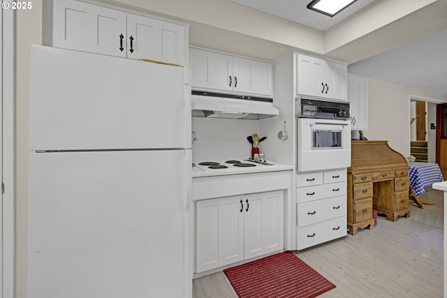 85304 Nestle Way, Pleasant Hill, OR 97455 - kitchen with white appliances, under cabinet range hood, light wood finished floors, white cabinetry, and a textured ceiling