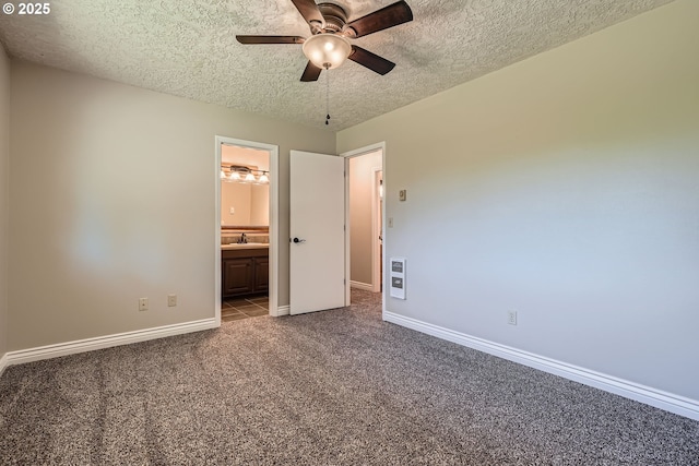 16127 NE Caples Rd, Brush Prairie, WA 98606 - unfurnished bedroom with carpet flooring, a textured ceiling, heating unit, connected bathroom, and ceiling fan