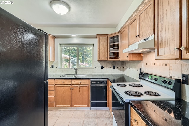 16127 NE Caples Rd, Brush Prairie, WA 98606 - kitchen featuring electric range oven, under cabinet range hood, freestanding refrigerator, tasteful backsplash, and glass insert cabinets