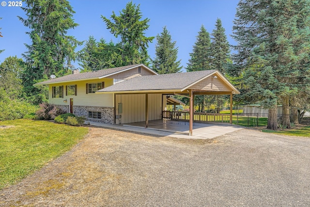 16127 NE Caples Rd, Brush Prairie, WA 98606 - view of front of house featuring a chimney, a carport, driveway, and a shingled roof