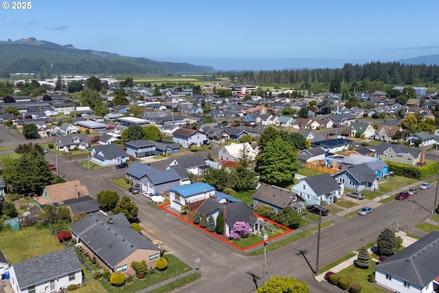 520 Elm Ave, Tillamook, OR 97141 - aerial perspective of suburban area featuring property parcel outlined and mountains