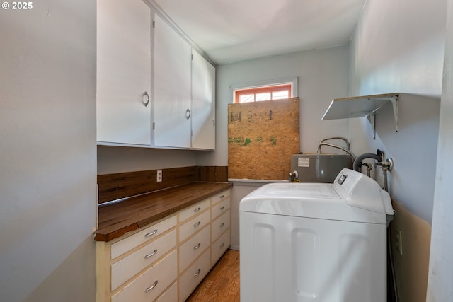 520 Elm Ave, Tillamook, OR 97141 - laundry area with washer / clothes dryer, cabinet space, water heater, and light wood-style floors