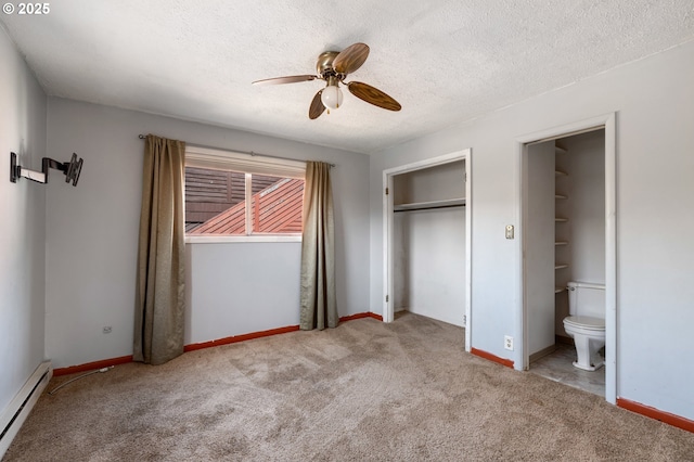 520 Elm Ave, Tillamook, OR 97141 - unfurnished bedroom with baseboard heating, carpet, a closet, baseboards, and a textured ceiling