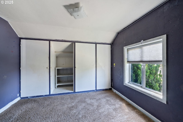 520 Elm Ave, Tillamook, OR 97141 - unfurnished bedroom featuring lofted ceiling, carpet flooring, baseboards, and a closet