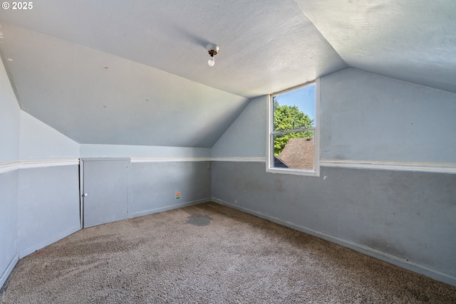 520 Elm Ave, Tillamook, OR 97141 - additional living space featuring vaulted ceiling, carpet flooring, and baseboards