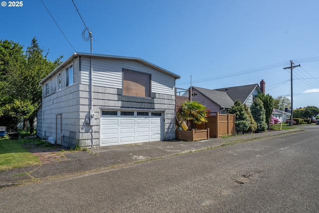 520 Elm Ave, Tillamook, OR 97141 - view of front of property featuring an attached garage and asphalt driveway