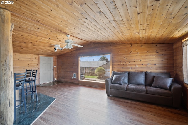 520 Elm Ave, Tillamook, OR 97141 - living area with wood walls, wooden ceiling, lofted ceiling, wood finished floors, and ceiling fan