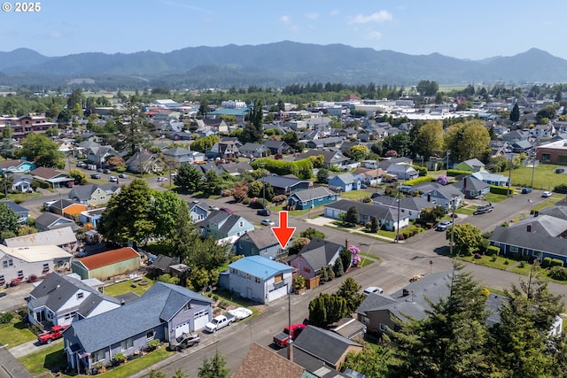 520 Elm Ave, Tillamook, OR 97141 - aerial perspective of suburban area featuring a mountain backdrop