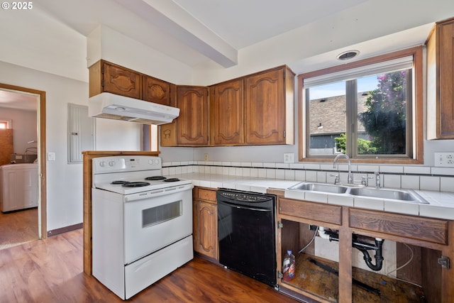 520 Elm Ave, Tillamook, OR 97141 - kitchen featuring black dishwasher, white range with electric cooktop, under cabinet range hood, washer / clothes dryer, and tile countertops